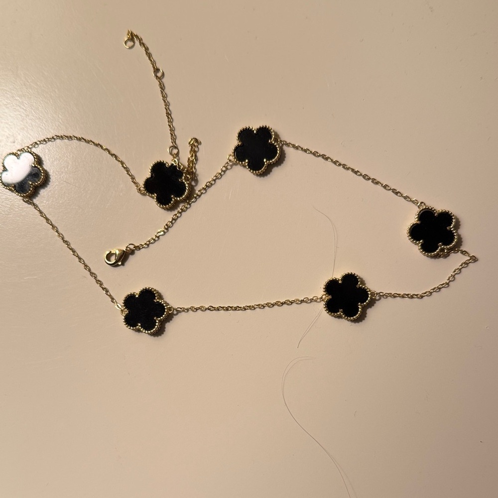 Elegant Black and Gold Clover Necklace